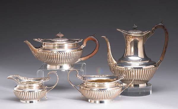 Appraisal: A Victorian silver and wood four piece tea and coffee