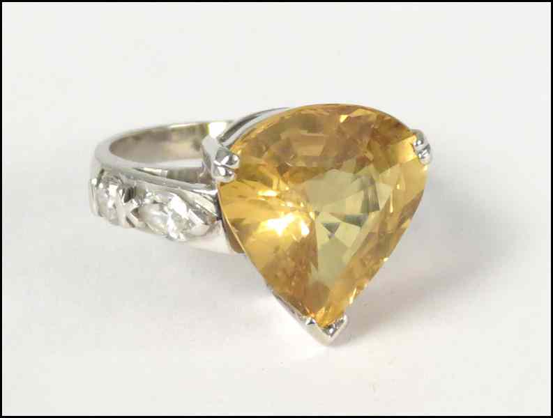 Appraisal: KARAT WHITE GOLD YELLOW SAPPHIRE AND DIAMOND RING Pear shaped