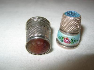 Appraisal: A THIMBLE the top inset with a dimple carved banded