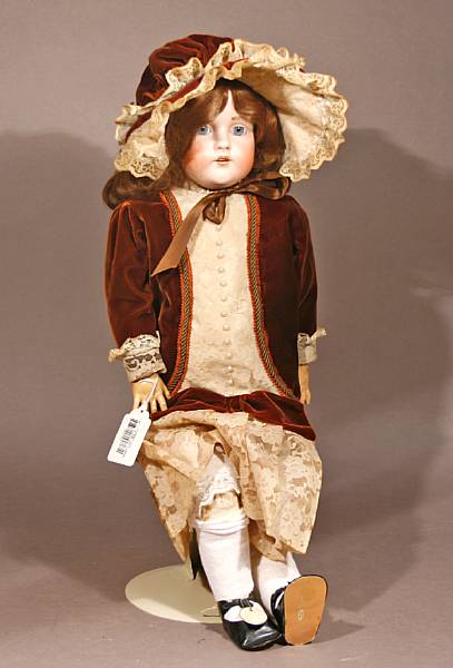 Appraisal: A German unmarked bisque shoulder head doll with a brown