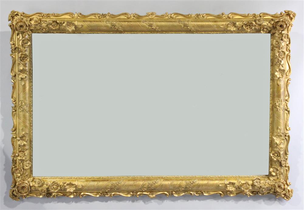 Appraisal: CARVED GILT WOOD FRAME FITTED WITH MIRROR PLATE the delicate