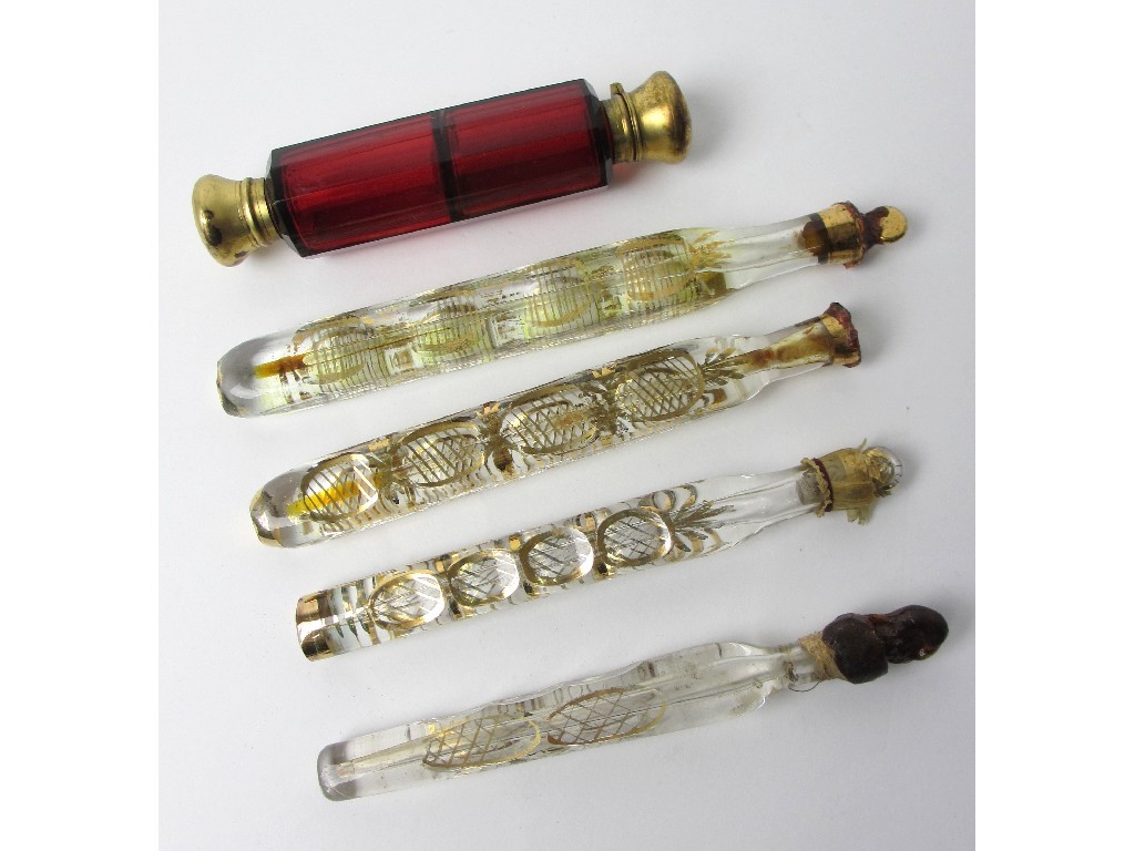 Appraisal: A Victorian red faceted glass double scent bottle and four