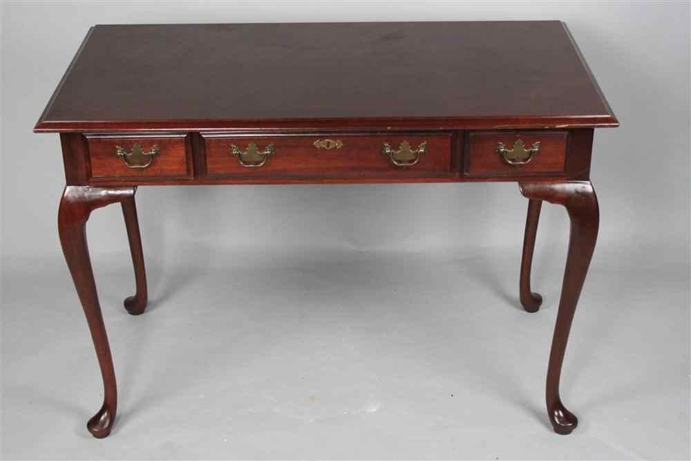 Appraisal: QUEEN ANNE STYLE MAHOGANY DESK the molded rectangular top over