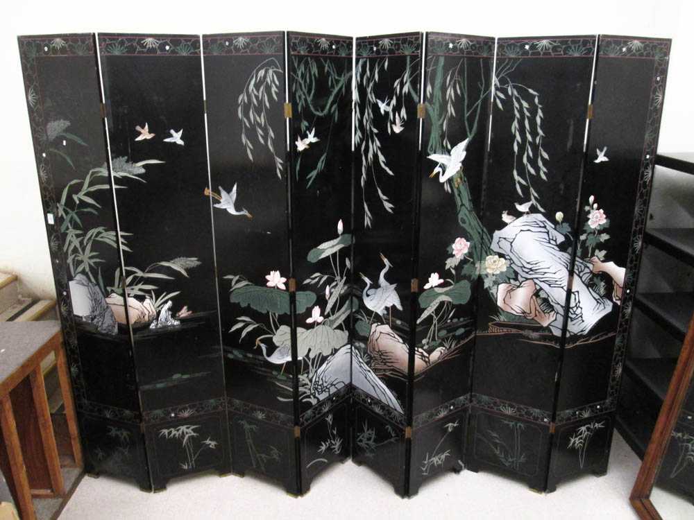 Appraisal: CHINESE EIGHT-PANEL COROMANDEL FLOOR SCREEN a black lacquer screen with