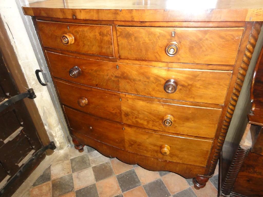 Appraisal: A Victorian mahogany bow fronted chest fitted with three long