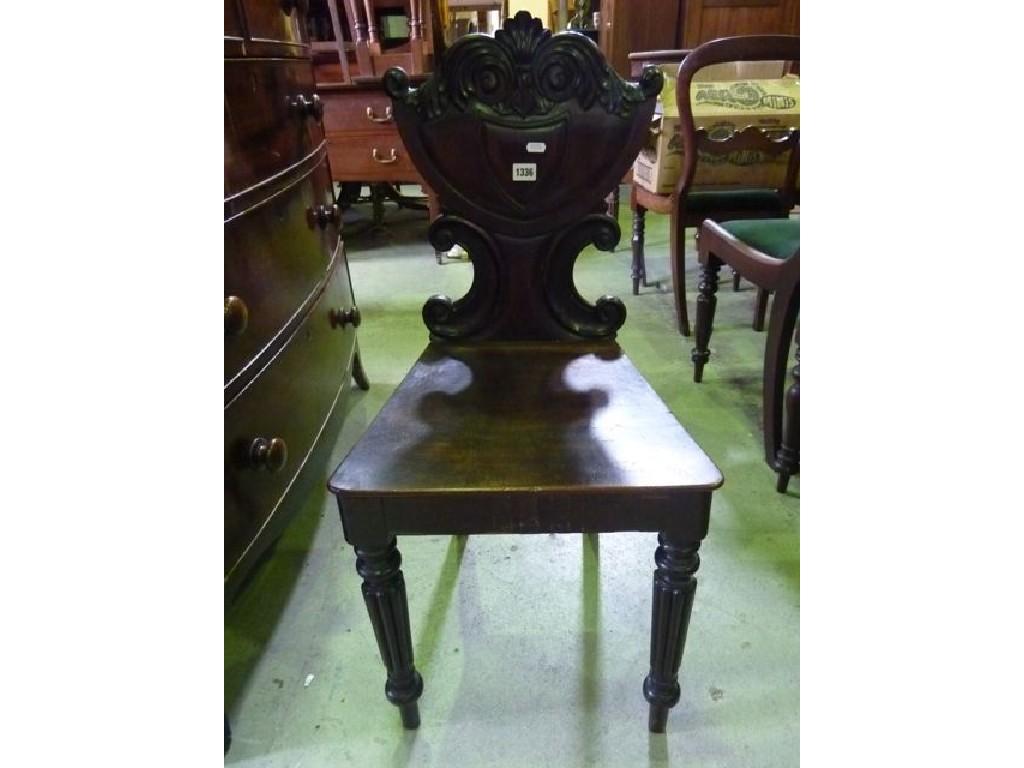 Appraisal: A th century mahogany hall chair the shield shaped back