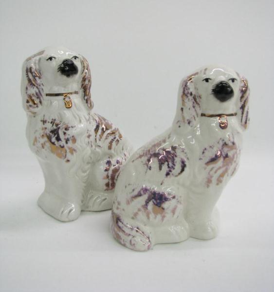 Appraisal: Pair of Marked Staffordshire Dogs with purple and gold paint