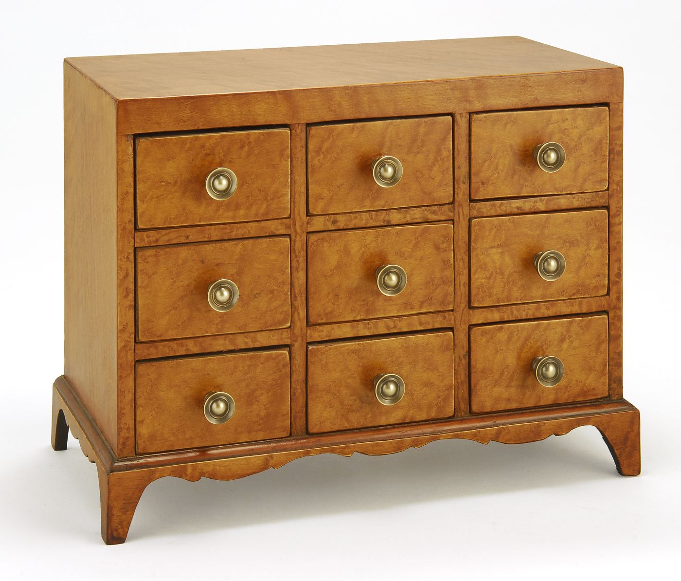 Appraisal: NINE-DRAWER SPICE CHEST th CenturyIn maple and bird's-eye maple Brass