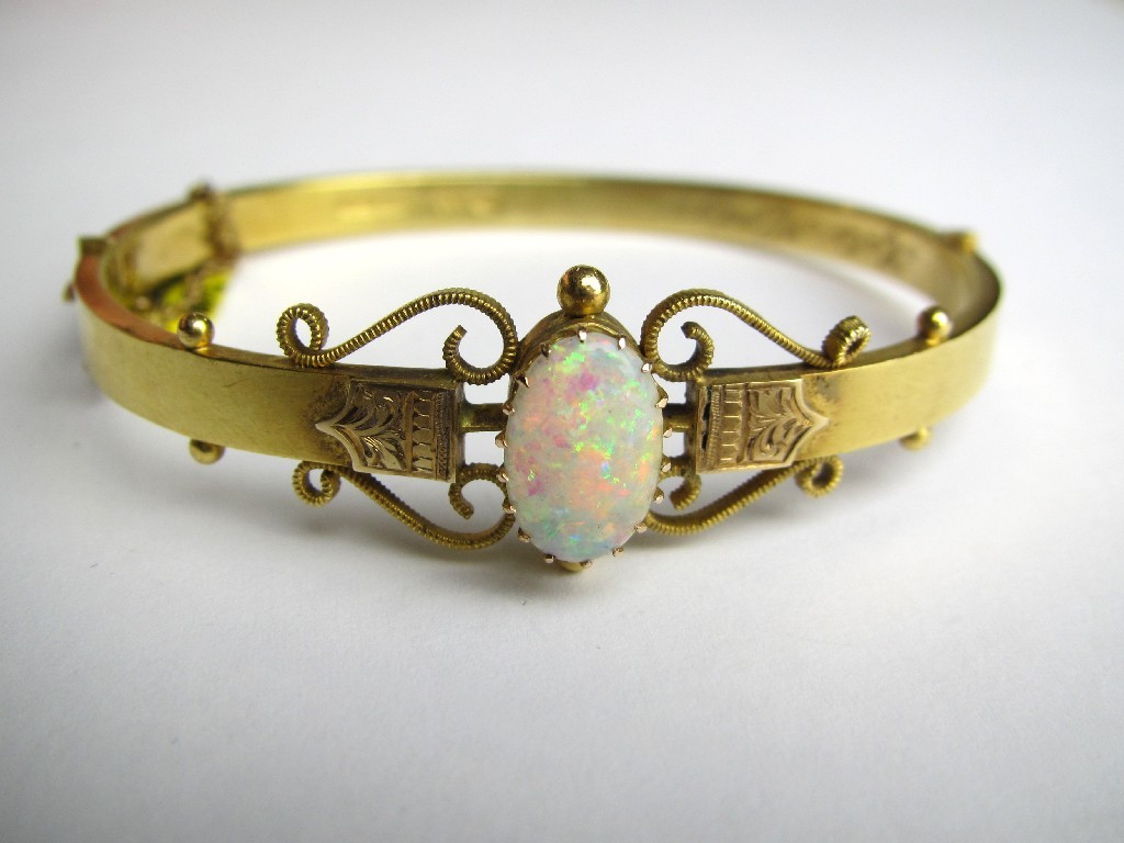 Appraisal: Victorian ct gold opal set hinged bangle with central oval