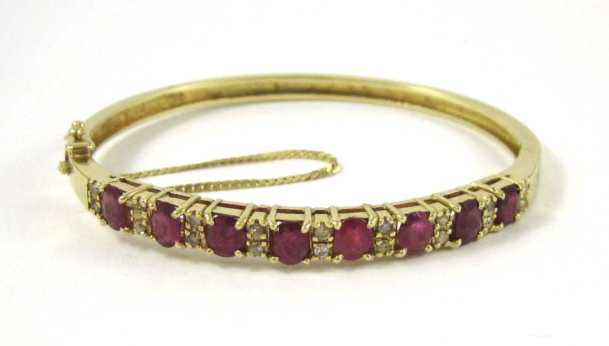 Appraisal: RUBY DIAMOND AND FOURTEEN KARAT GOLD BANGLE The oval hinged