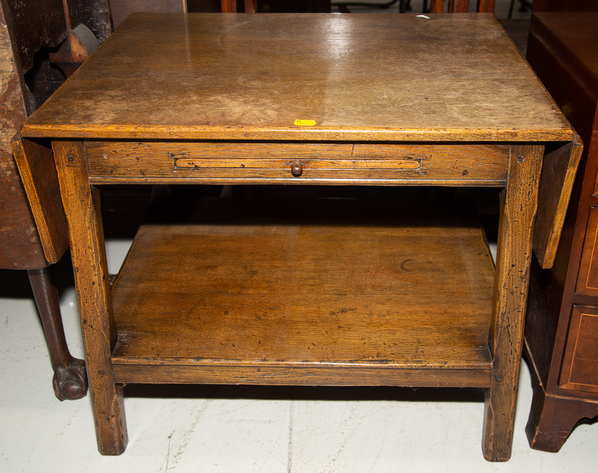 Appraisal: PROVINCIAL STYLE OAK OCCASIONAL TABLE Bench made with pegged mortise