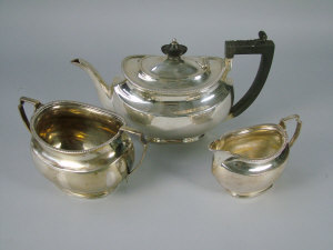 Appraisal: A Georgian style silver three piece tea set Sheffield comprising