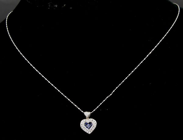 Appraisal: k white gold diamond and sapphire pendant with k white