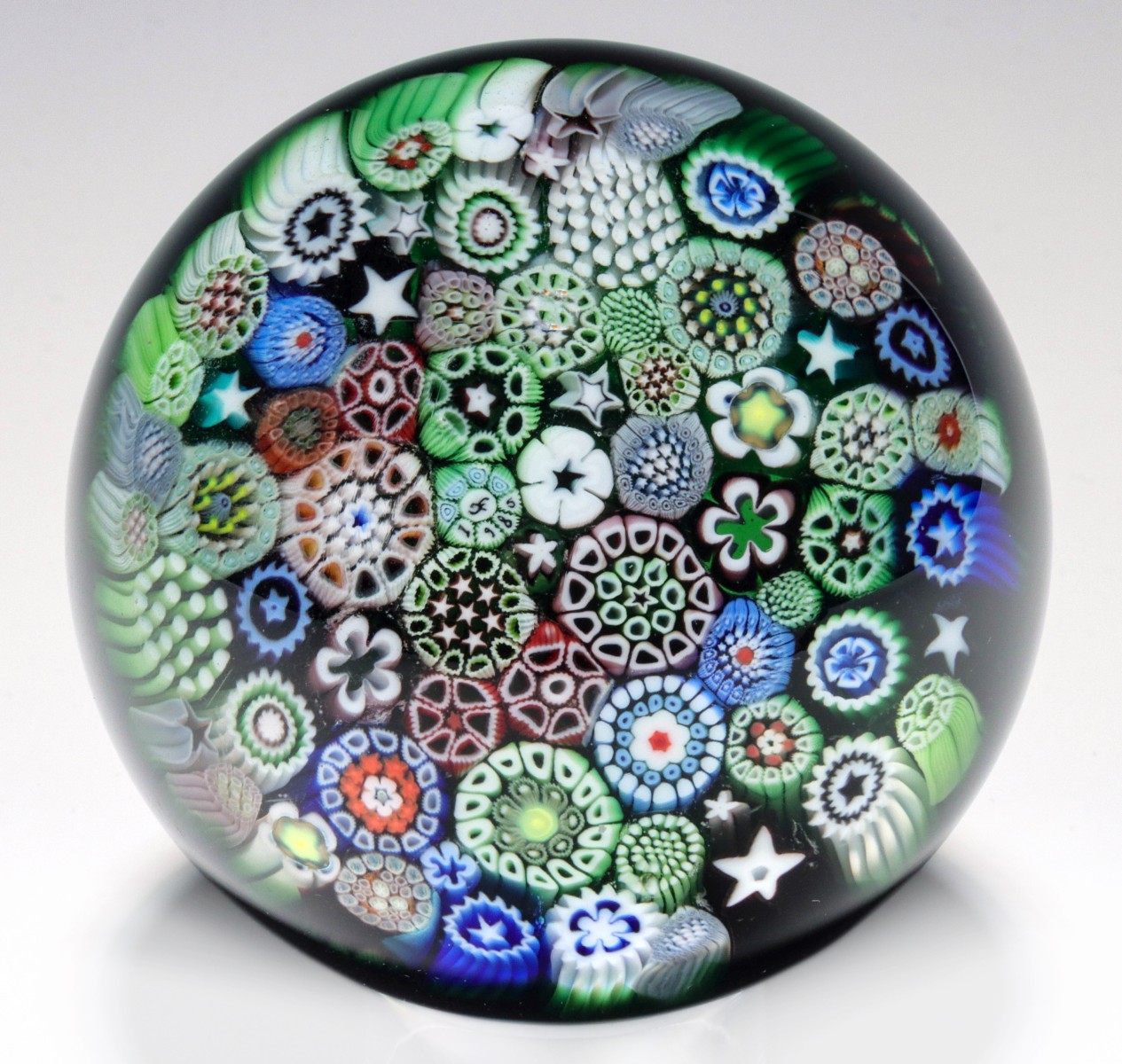 Appraisal: AN ORIENT AND FLUME CLOSEPACK MILLEFIORI PAPERWEIGHTThe closepack millefiori paperweight