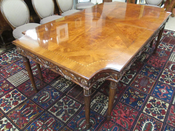 Appraisal: LOUIS XVI STYLE RECTANGULAR MAHOGANY DINING TABLE WITH TWO LEAVES