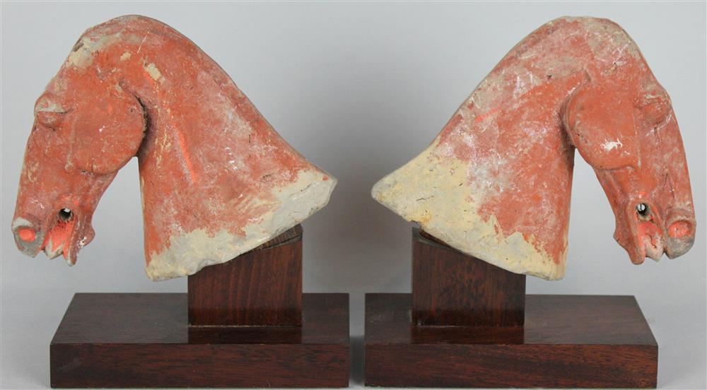 Appraisal: PAIR OF CHINESE HAN STYLE PAINTED TERRACOTTA HEADS OF HORSES