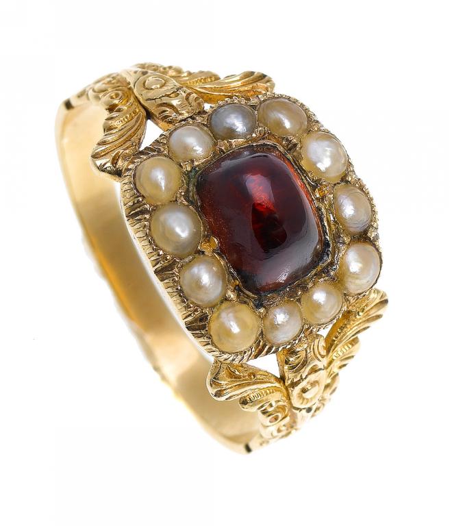 Appraisal: AN ANTIQUE GARNET AND SPLIT PEARL RING the oblong cluster