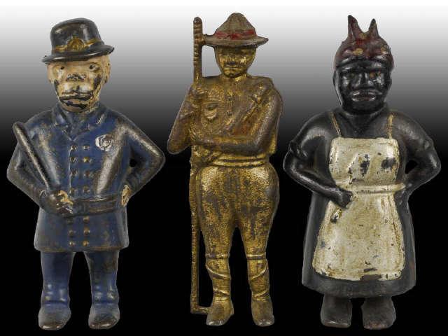 Appraisal: Lot of Cast Iron Figural Still Banks Description Policeman Aunt