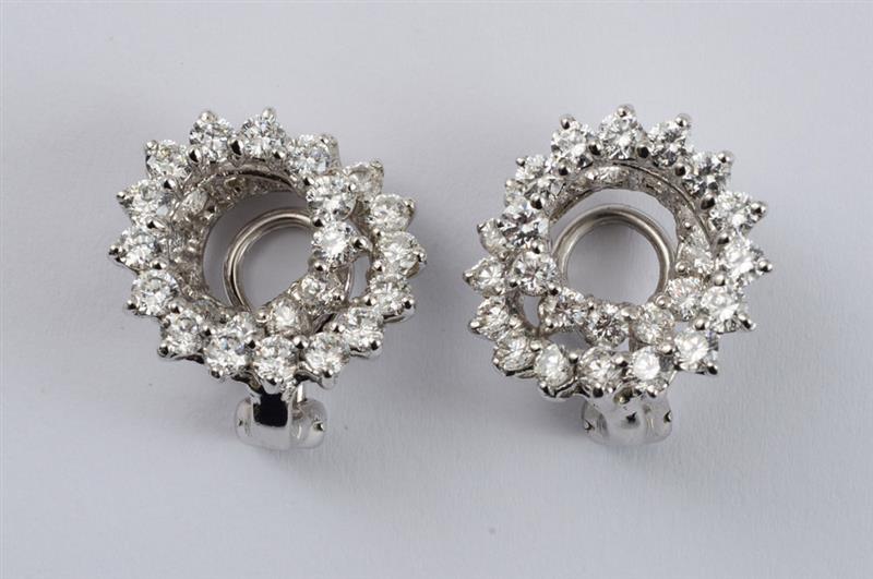 Appraisal: PAIR OF K WHITE GOLD AND DIAMOND SWIRL EARCLIPS With