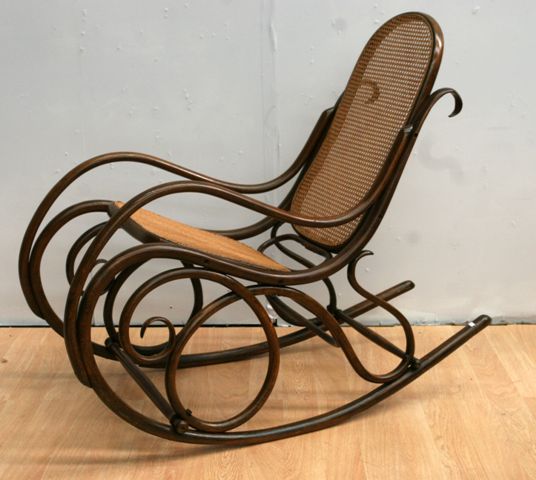 Appraisal: A th century bentwood and caned rocking chair