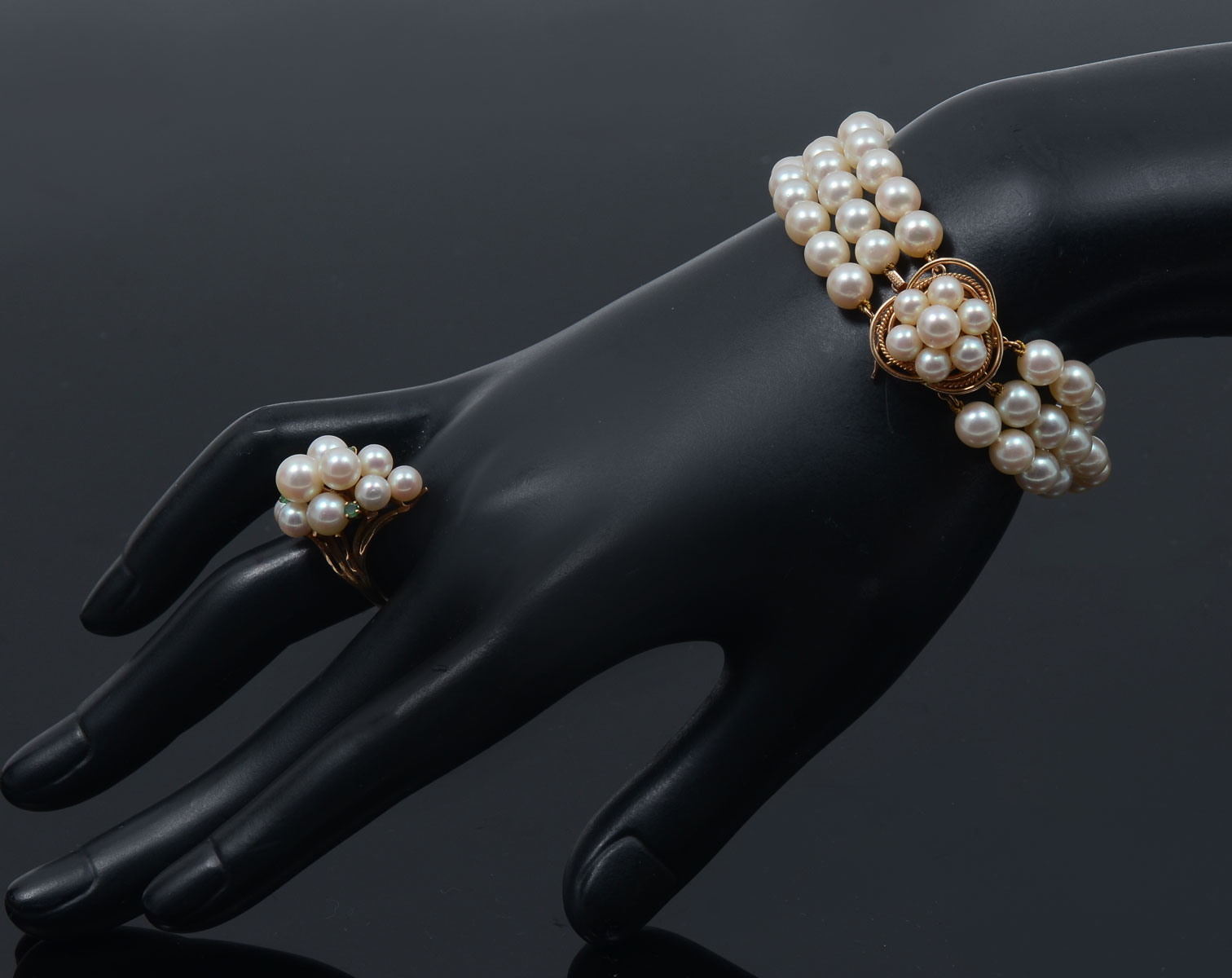 Appraisal: K PEARL BRACELET RING WITH EMERALDS strand pearl bracelet has