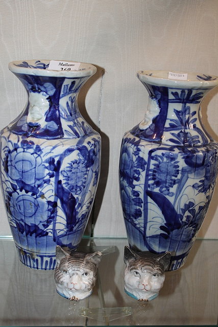 Appraisal: A PAIR OF JAPANESE IMARI BLUE AND WHITE PORCELAIN VASES