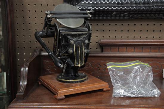 Appraisal: MINIATURE PRINTING PRESS WITH TYPE Black painted cast iron table