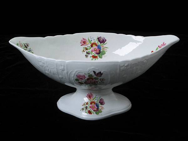 Appraisal: An English glazed earthenware footed dish painted with floral sprays