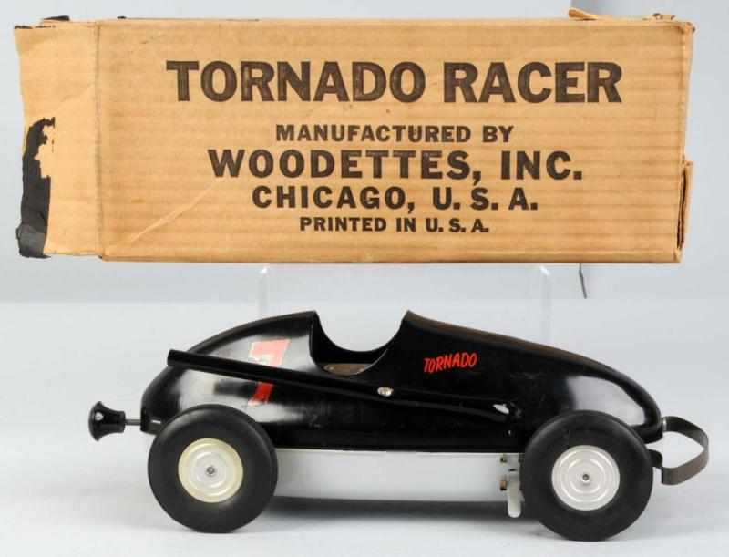 Appraisal: Pressed Steel Woodette Tornado Race Car Toy Description Decals on