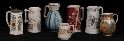 Appraisal: SEVEN ASSORTED ENGLISH AESTHETIC MOVEMENT POTTERY PITCHERS Each with transfer