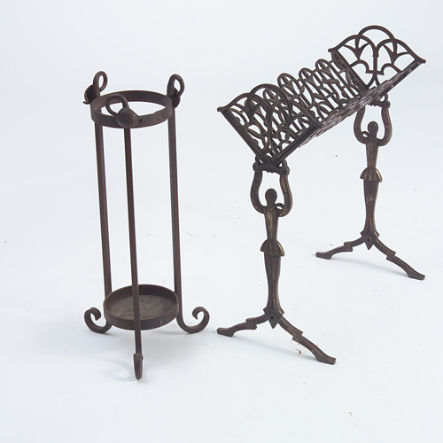 Appraisal: Two iron pieces a figural book stand and an umbrella