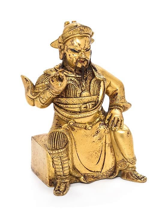 Appraisal: A Small Gilt Bronze Figure of Guandi Height inches A