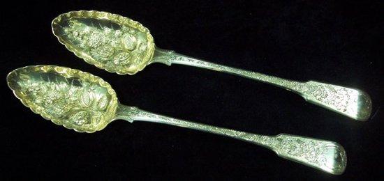 Appraisal: A pair of fiddle pattern berry spoons with engraved decoration