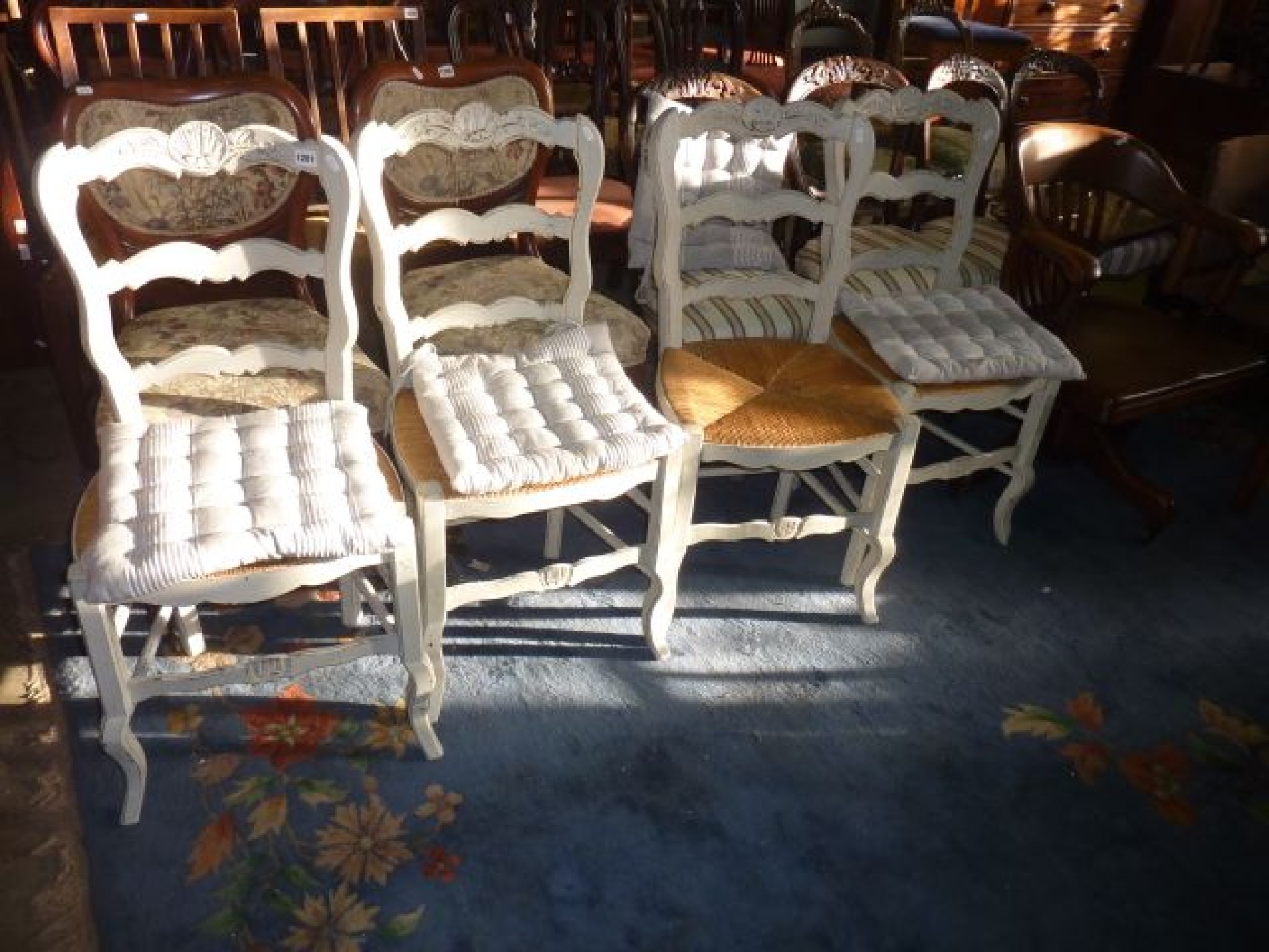 Appraisal: A set of four French provincial ladderback dining chairs with