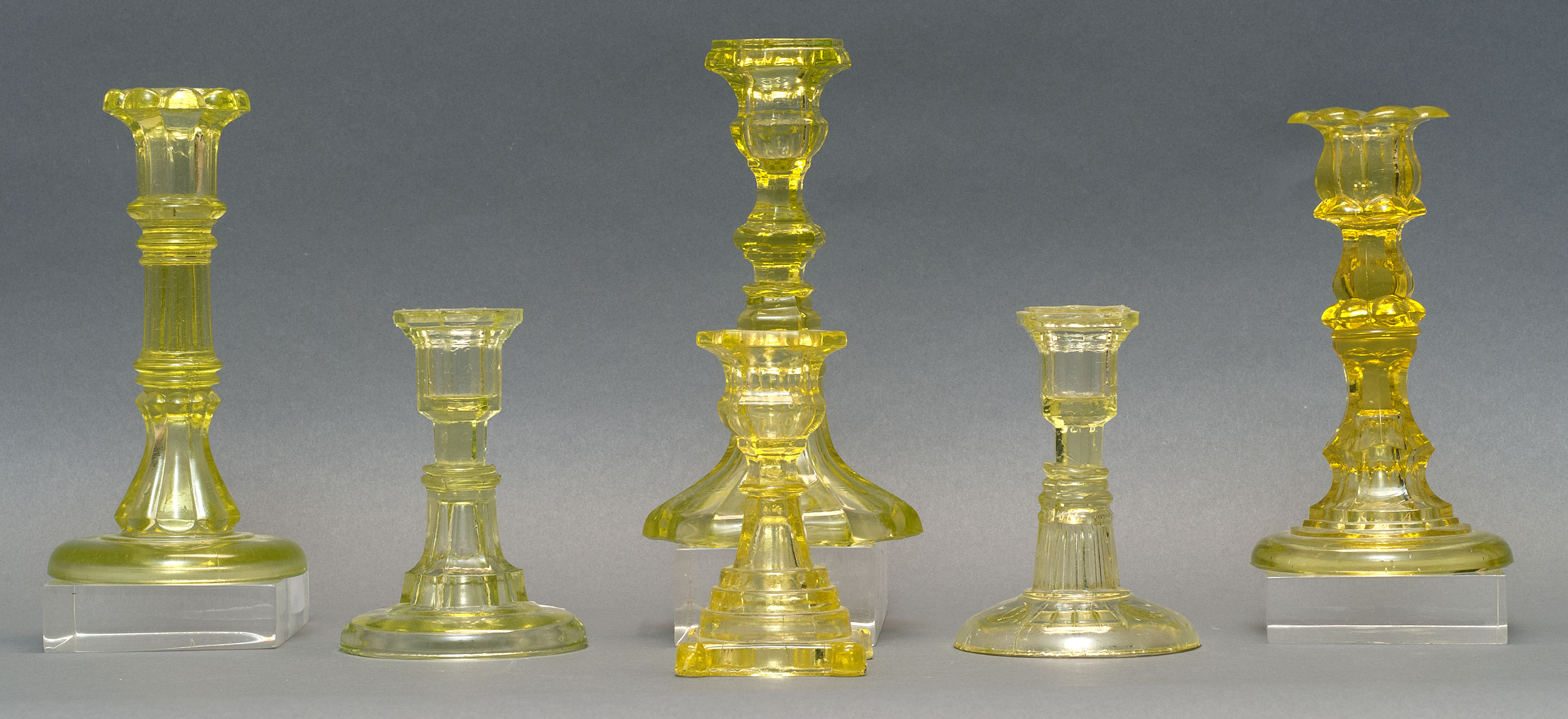 Appraisal: SIX PRESSED GLASS CANDLESTICKS th CenturyIn varied forms all in