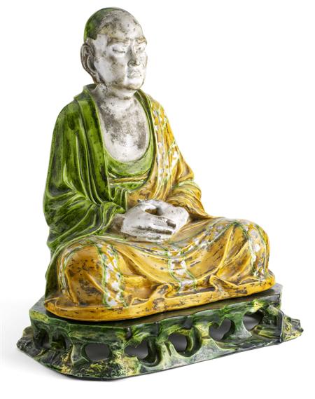 Appraisal: A Chinese pottery figure of a lohan In the Liao