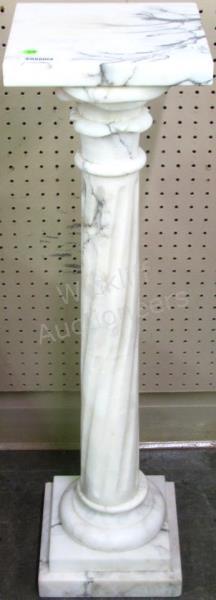 Appraisal: A white marble pedestal with gray veining removable top plate