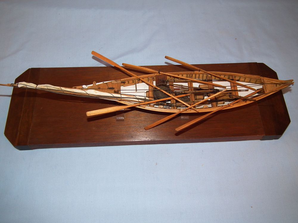 Appraisal: WOOD WHALEBOAT MODEL Antique wood whaleboat model with metal-tipped harpoons