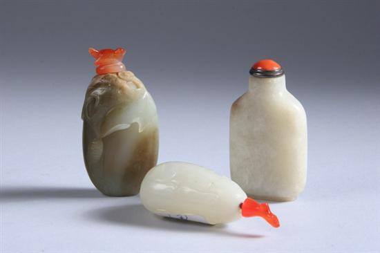 Appraisal: TWO CHINESE CELADON JADE SNUFF BOTTLES One carved to depict