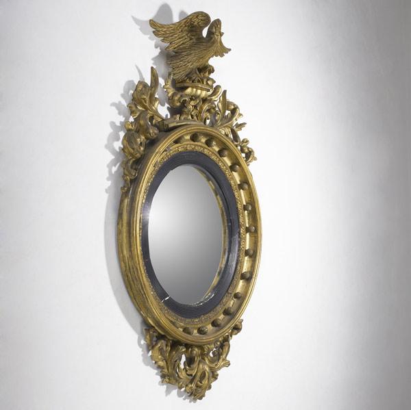 Appraisal: ENGLISH GIRANDOLE MIRROR With ornate decoration and elaborate eagle finial