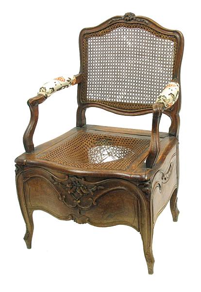 Appraisal: A Louis XV Provincial carved oak caned commode chair late