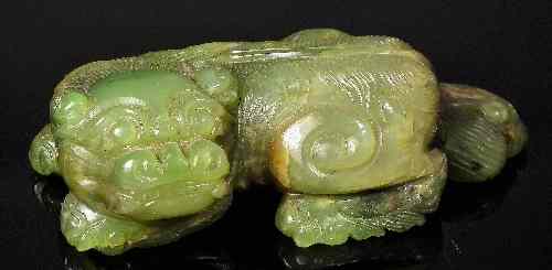 Appraisal: A Chinese spinach green jade carved model of a Dog