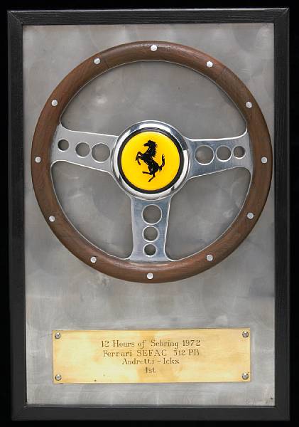 Appraisal: A miniature 'Ferrari Andretti-Ickx' steering wheel wooden rimmed with Ferrari