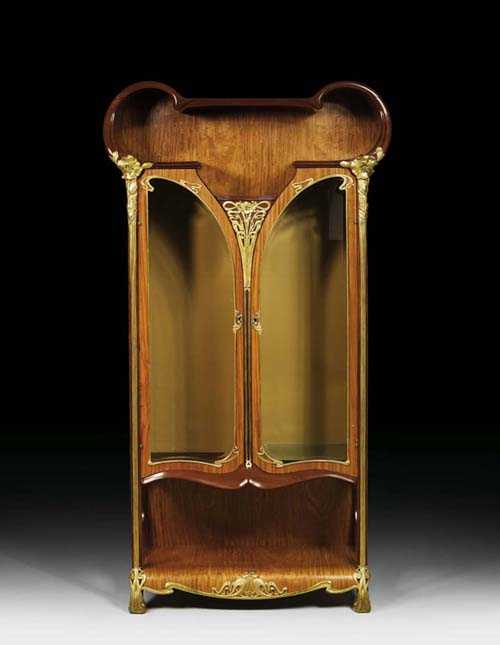 Appraisal: SHAPED VITRINE probably France circa Lemonwood With rich and finely