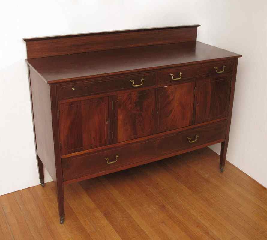 Appraisal: FLAME GRAIN STRING INLAY MAHOGANY SIDEBOARD High backsplash half drawers