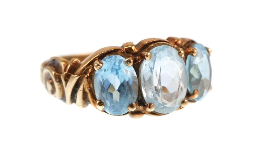 Appraisal: K yellow gold ring contains oval faceted blue topaz WEIGHT