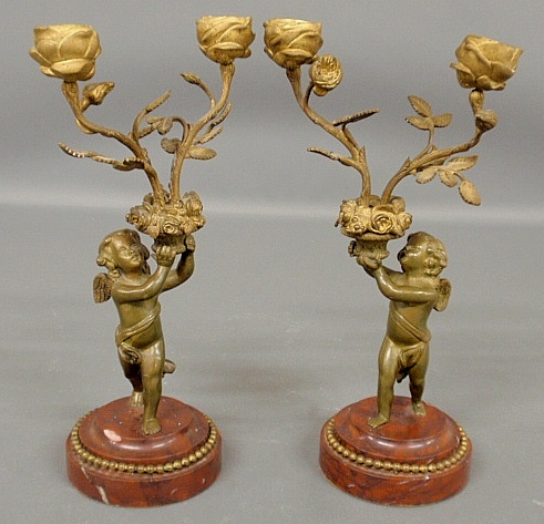 Appraisal: - Pair of Italian bronze putti candlesticks late th c