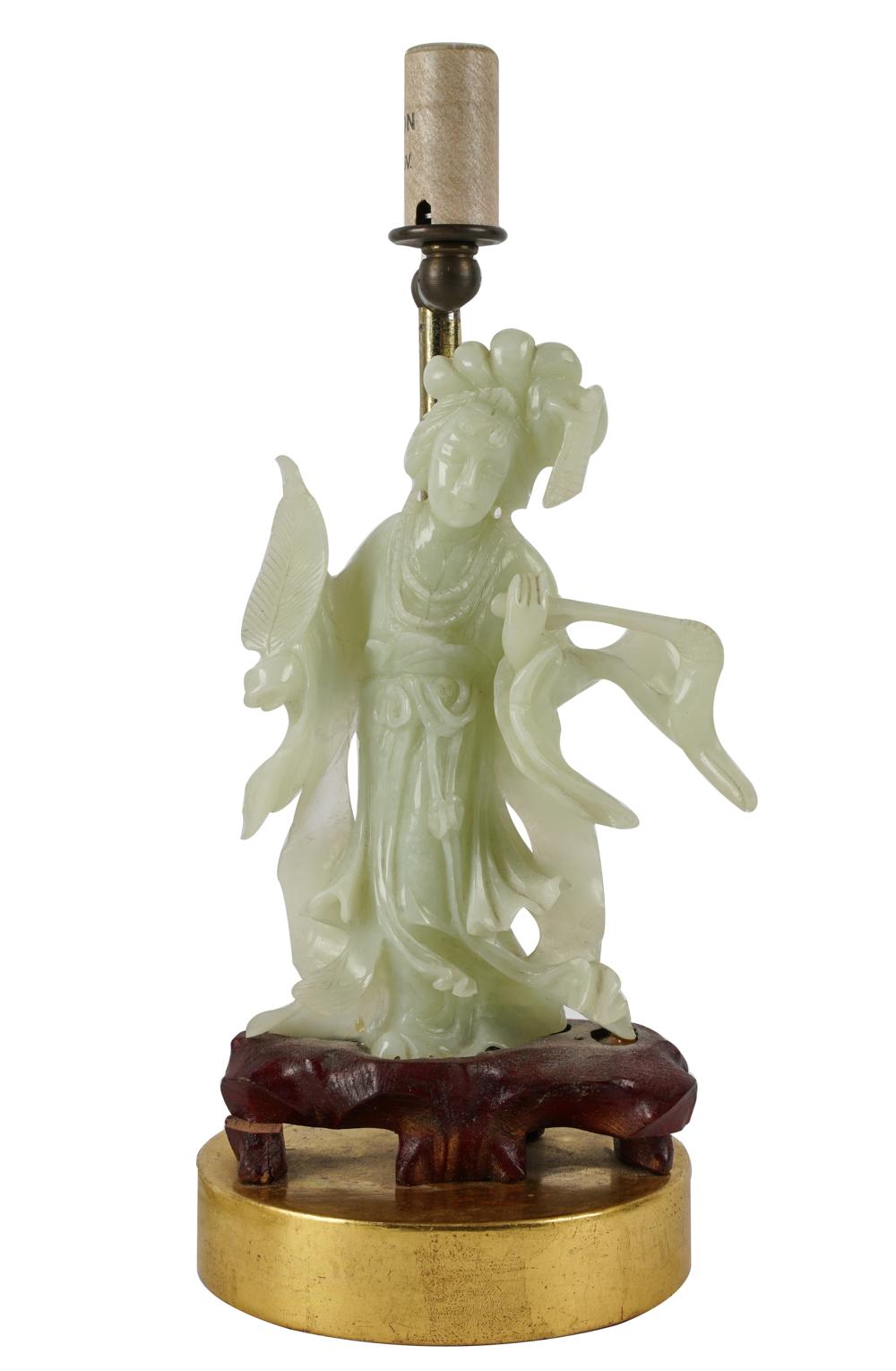 Appraisal: CHINESE CARVED GREEN STONE FIGUREmounted on a wooden base in