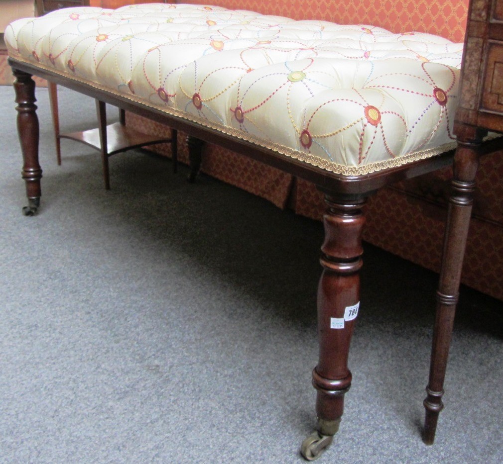 Appraisal: A large rectangular mahogany framed footstool on baluster turned supports