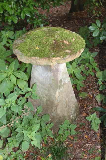 Appraisal: A SANDSTONE STADDLE STONE the square top and rough cut